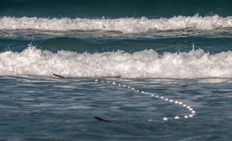 arrasto em área de arrebentação, RS 